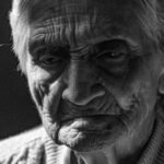 Intimate black and white portrait capturing the deep expressions of an elderly person, highlighting wisdom.